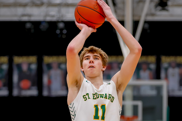st edward bsaketball player takes a free throw shot