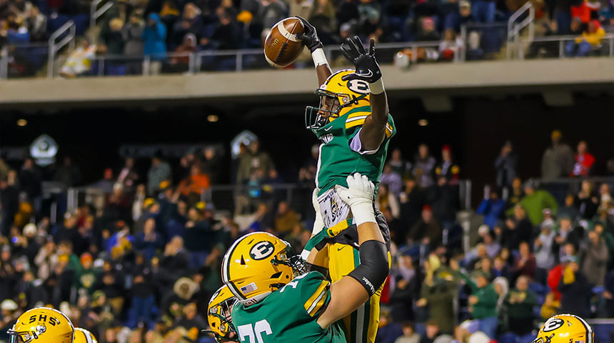st edward varsity football players celebrate after scoring a touchdown