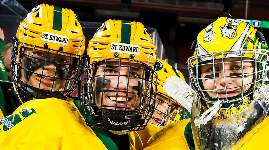 three st edward high school hockey players pose for a candid photo