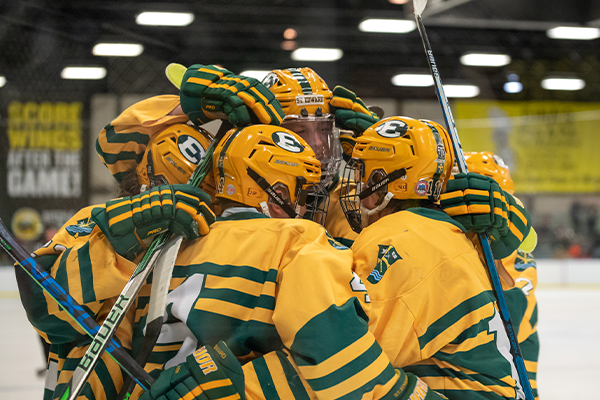 st. edward high school hockey players after winning a game