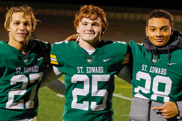 three student-athletes in the st edward high school football program