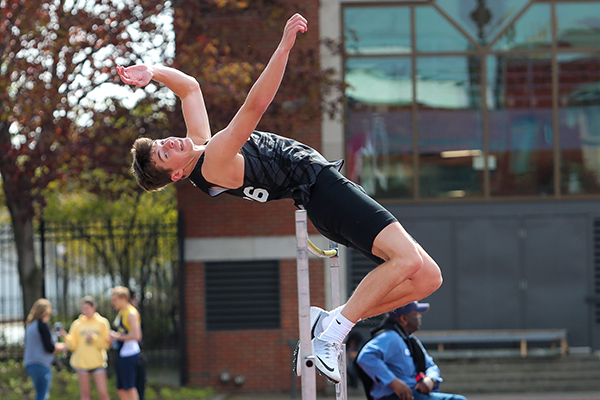 st. edward track and field athlete doing the high jump