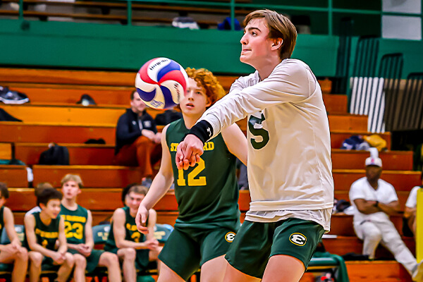 st. edward high school volleyball player returning the ball