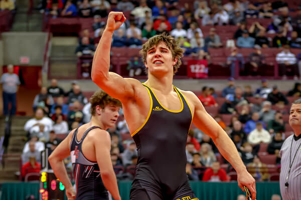 st. edward high school wrestler after winning a match