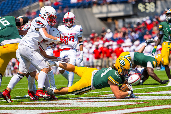 st edward varsity football player scores a touchdown against center grove