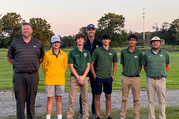 members of the st. edward high school jv golf team with their coaches