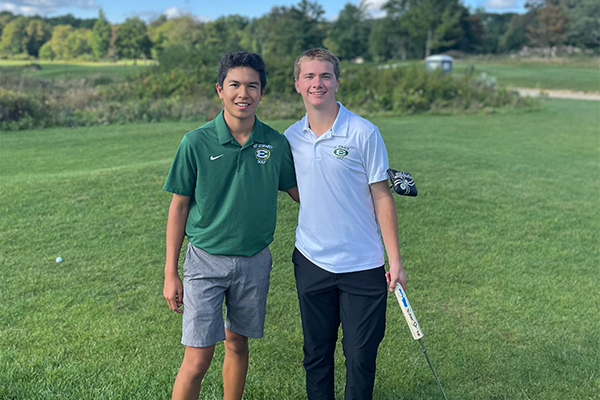 two varsity golfers at st. edward high school