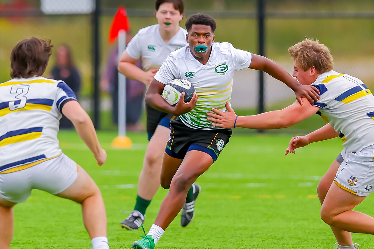 st. edward high school players in a rugby sevens match