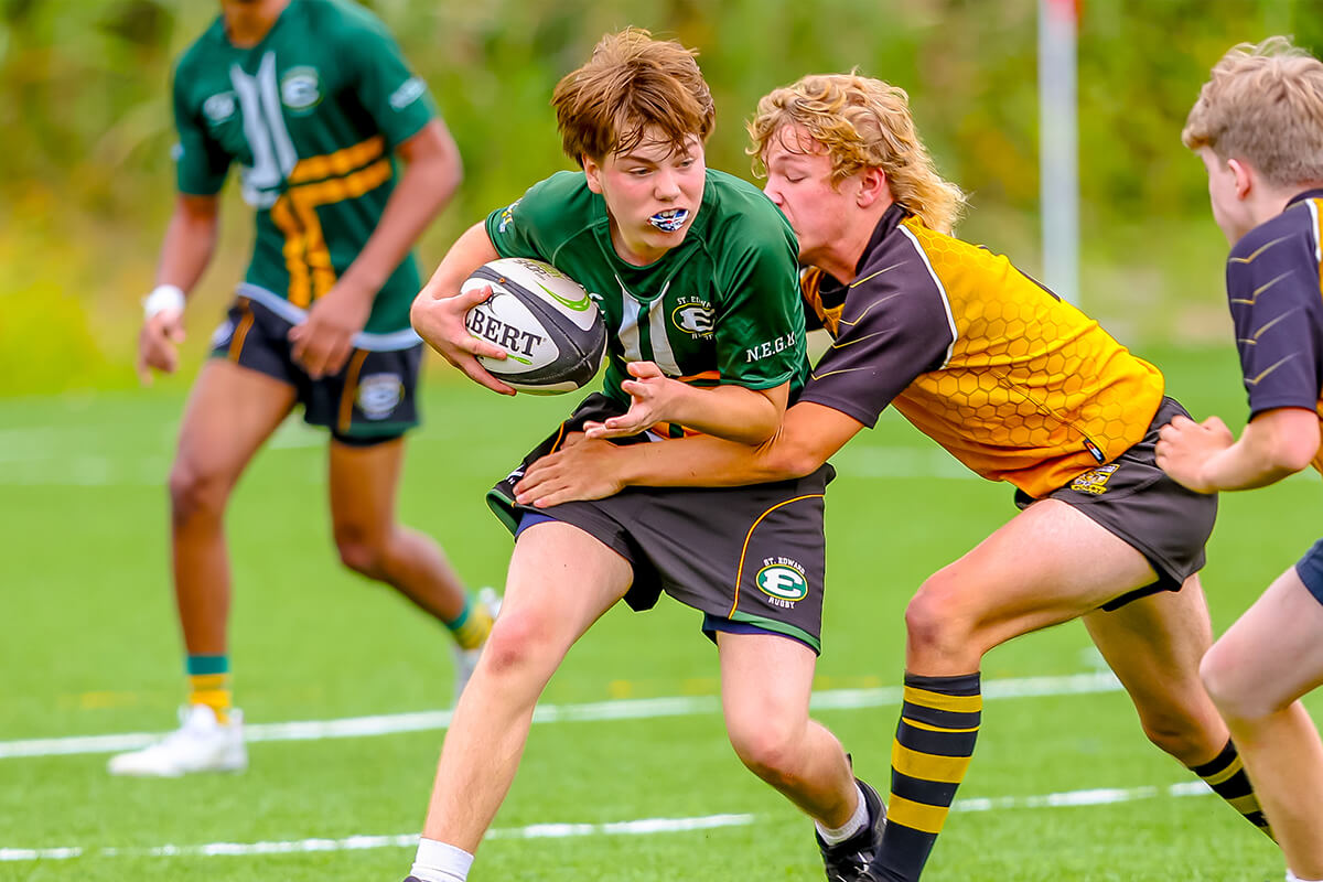 st. edward high school players in a rugby sevens match