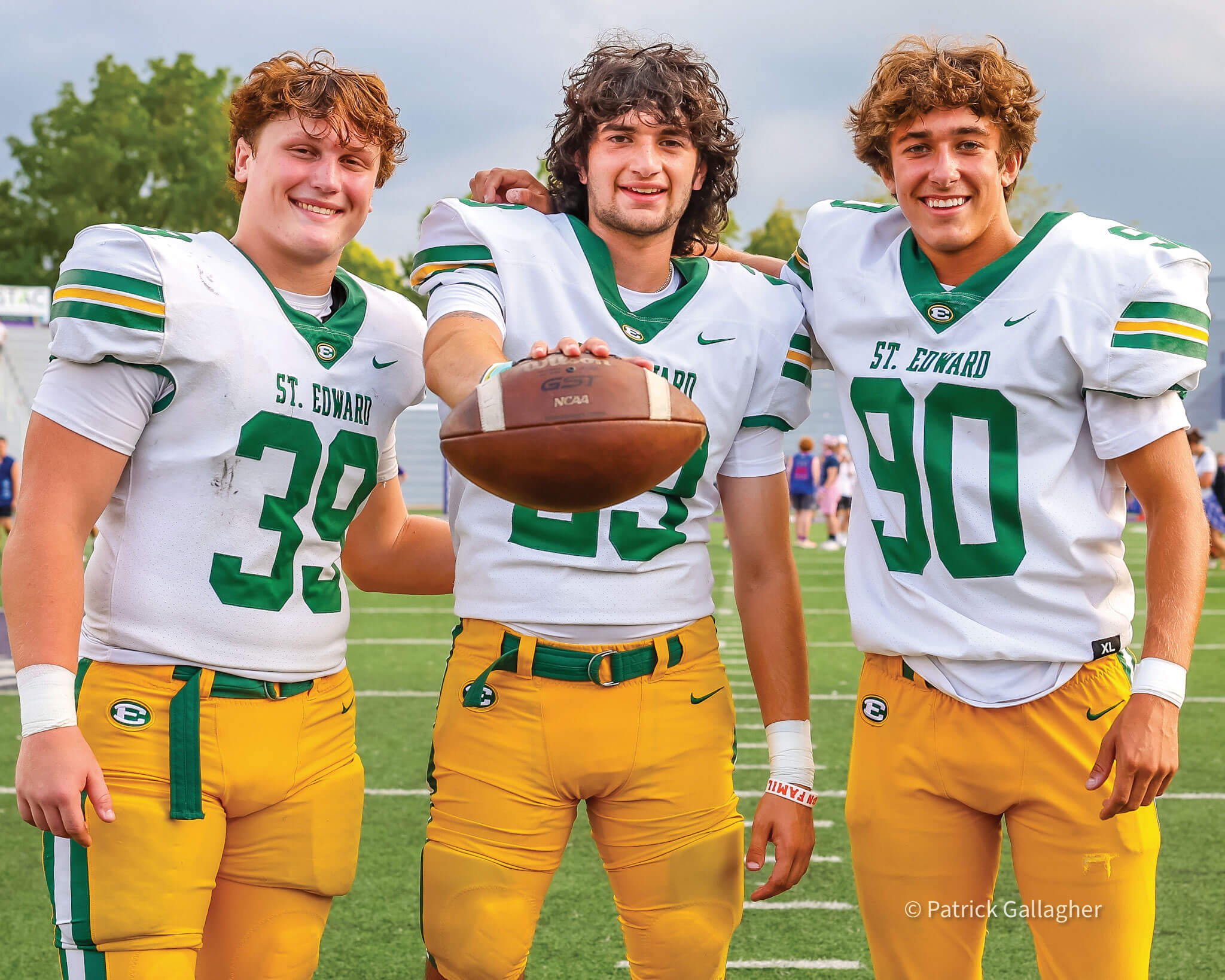 three members of the st. edward varsity football team