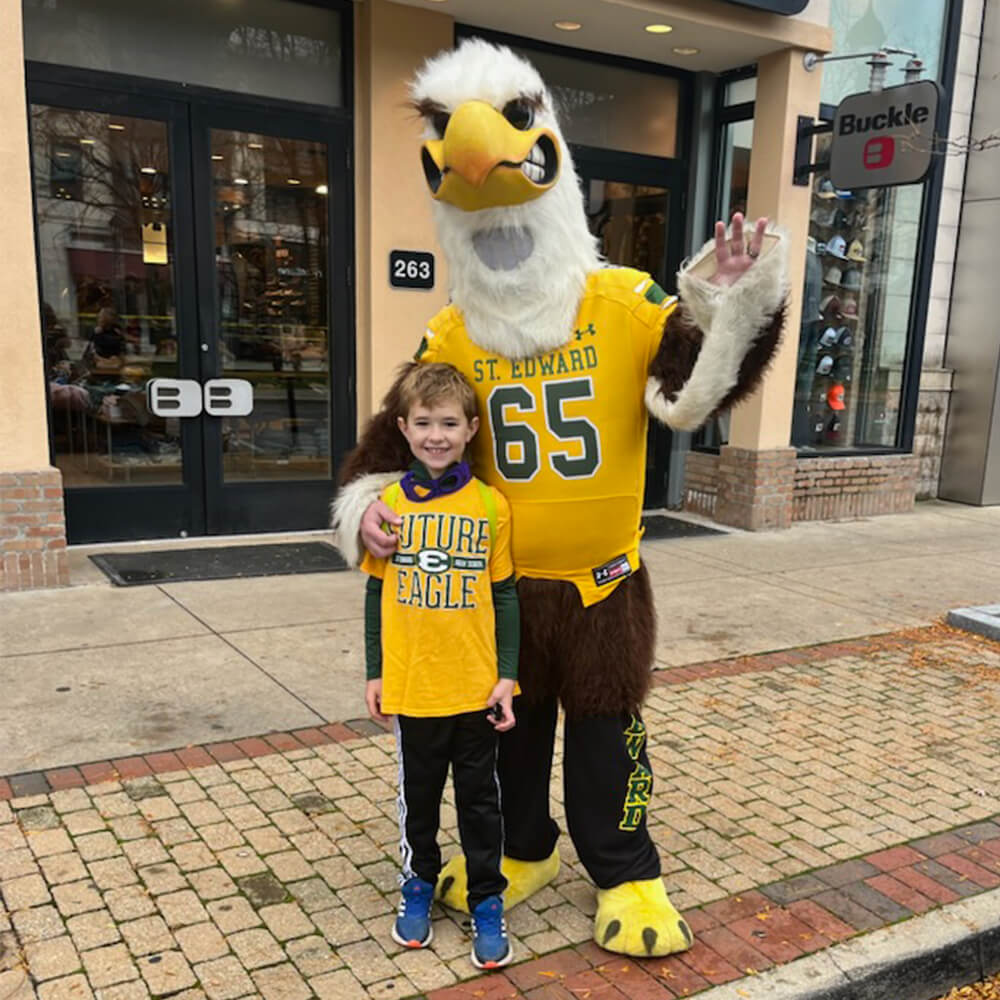 eagle man posing with a future eagle at crocker park