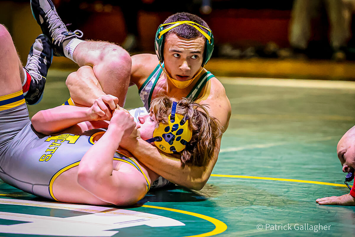 st. edward wrestler in a match against a saint ignatius wrestler