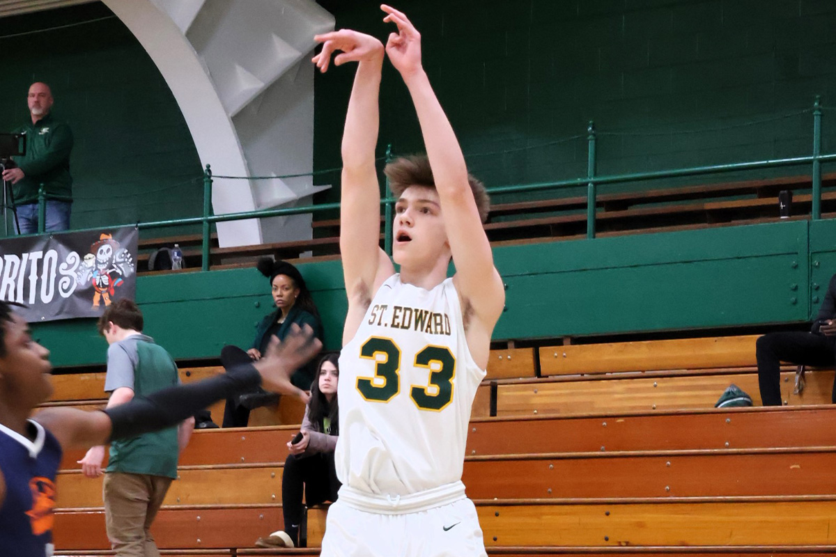 freshman gold basketball player shooting a three-pointer