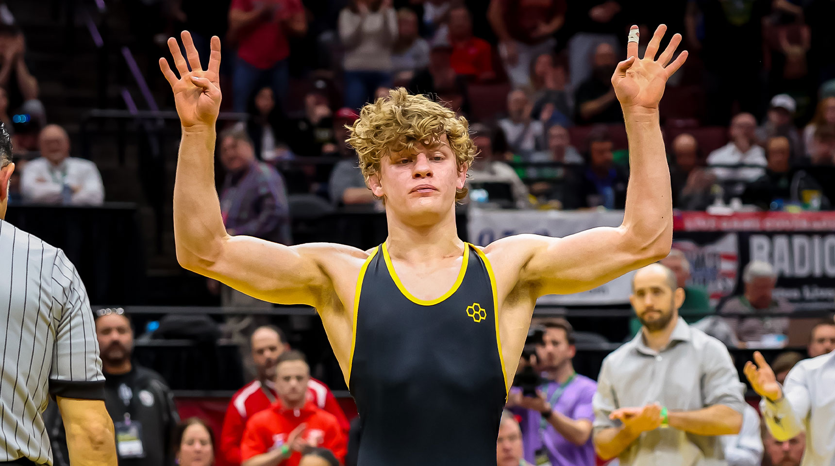 karson brown holds up four fingers after clinching his fourth individual championship